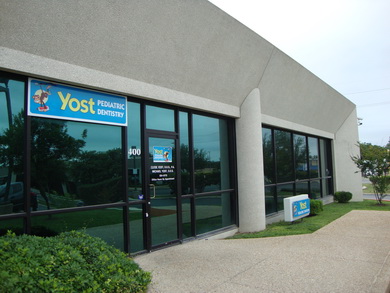 Photo of office front door for pediatric dentists - Drs. Michael and Clyde Yost in San Antonio, TX